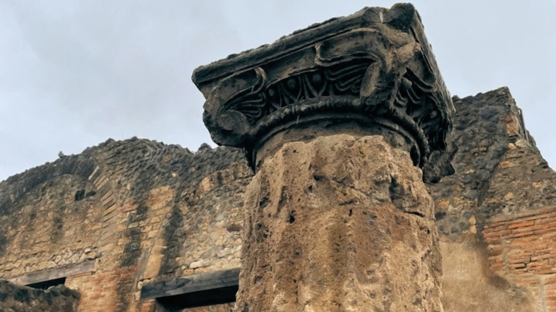 Weathered column among ancient ruins